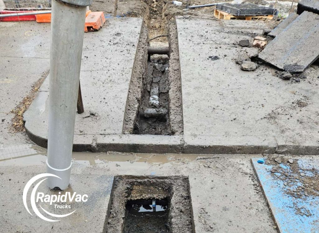 Non-destructive digging using vacuum excavation to protect underground utilities.